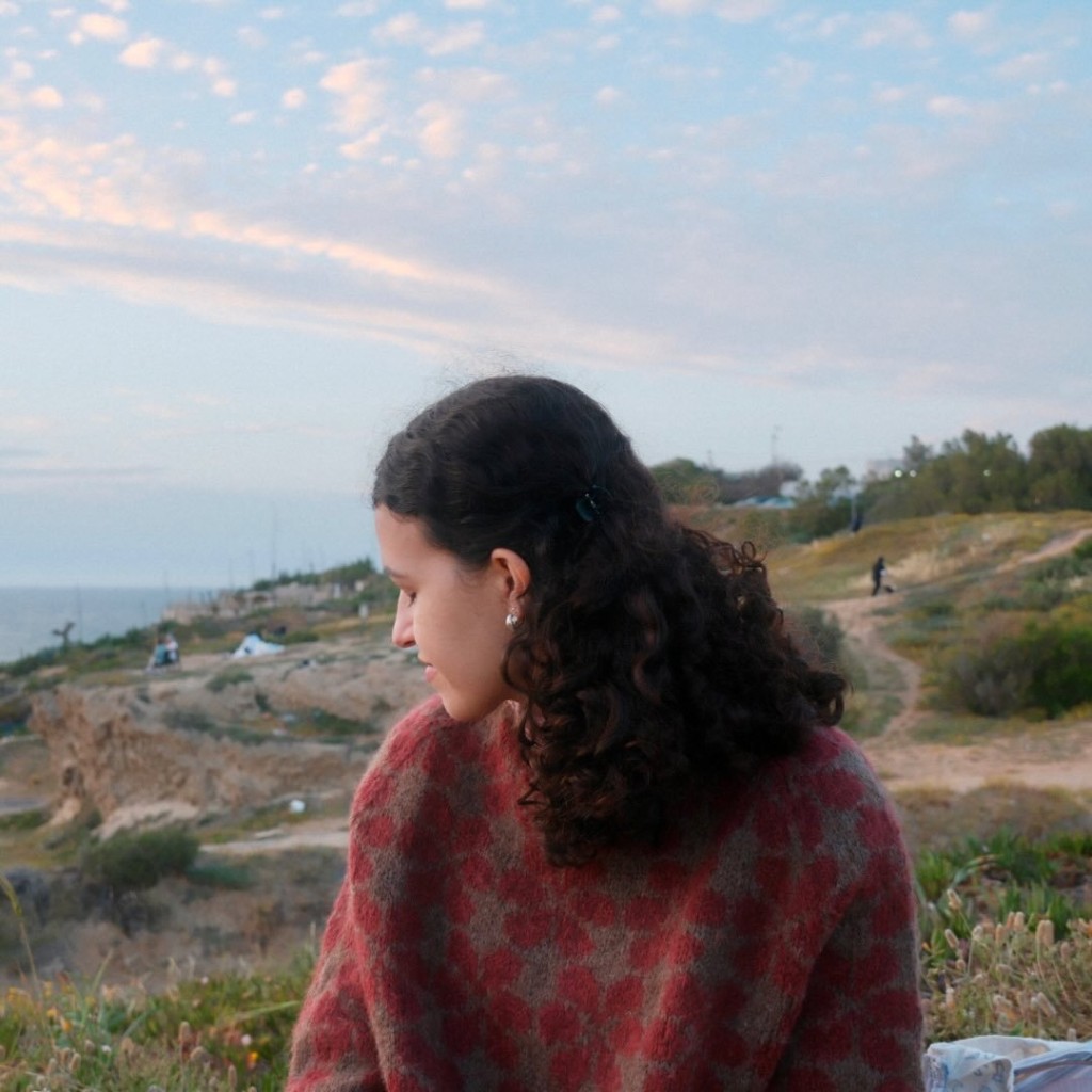 Portrait wearing a hand-knit sweater outdoors